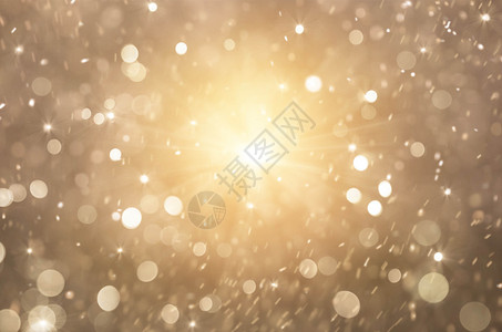 金色闪亮的金色灯光背景圣诞节灯光和抽象闪烁的恒星图片