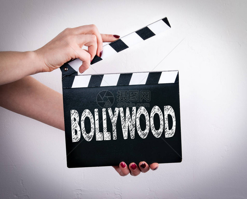 Bollywood女手握着电影拍图片