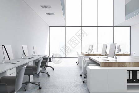 白开放办公用房内白色木制桌和两排电脑背景图片