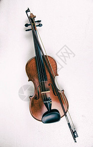 木小提琴和弓的抽象艺术设计背景图片