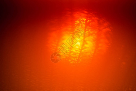 橙色温暖的模糊抽象背景阳光照耀在亚图片