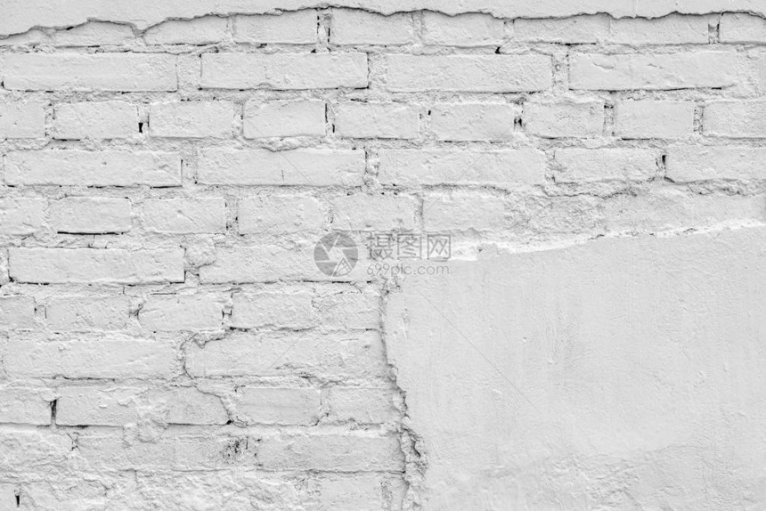 旧砖墙表面的古板和抽象纹理背景白色石膏被毁坏的图片