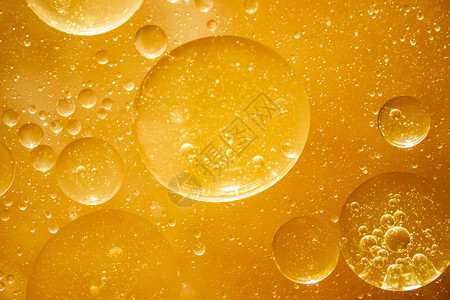 金黄色油滴水滴金黄色气泡油抽象背景插画