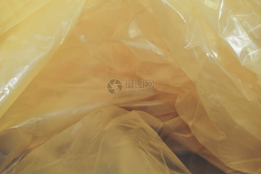 美丽的黄色塑胶袋抽象背景图片