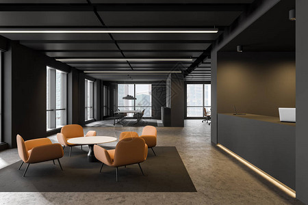 来宾签到时尚的办公室内部有灰色的墙壁混凝土地板灰色的接待台带橙色扶手椅和咖啡桌的休息区以及背景中的会议室设计图片