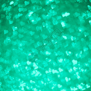 抽象光绿色的心形布OKH模式圣情人节或假日概图片