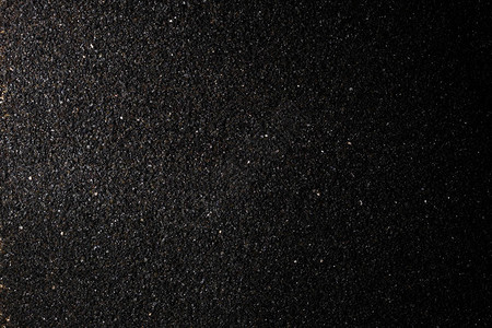 黑色粉碎的炭疽颗粒黑色粉碎后的亮光背景图片