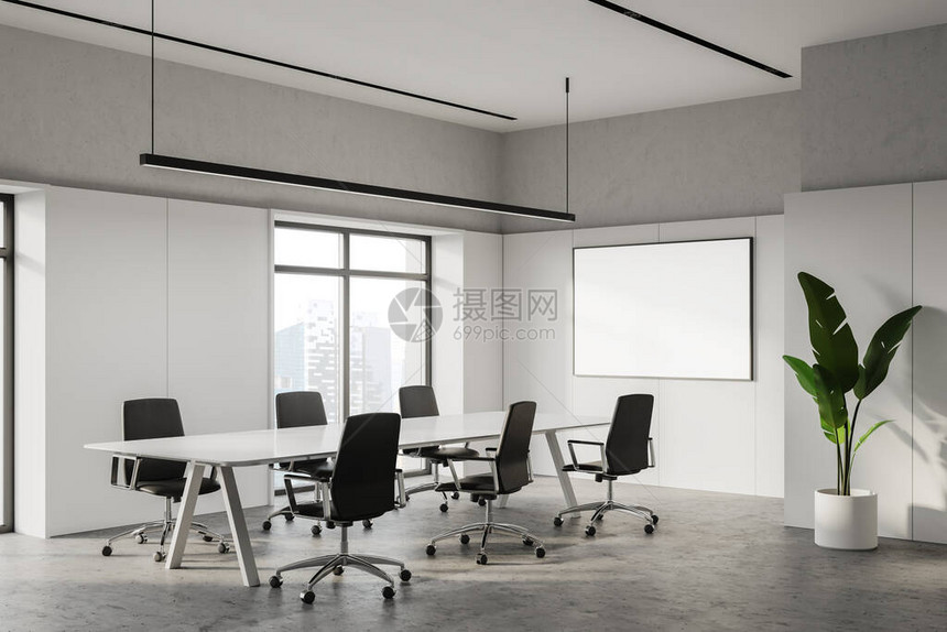 现代会议室的角落有白色和混凝土墙带黑色扶手椅的白色长会议桌水平模拟海报框架和带有模糊城市景观的窗户图片