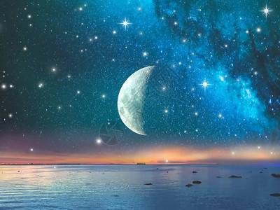夜深蓝暗宇宙的星夜天空上的热带月亮宇宙明光海景背图片