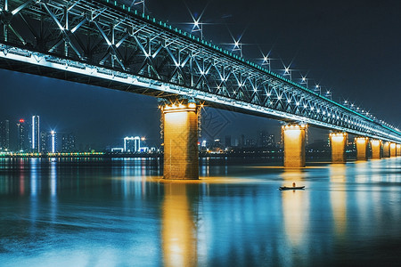 夜晚的船武汉夜晚灯光全亮的长江大桥背景