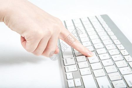 电脑通讯手指点击电脑键盘背景