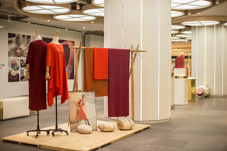 红色服装素材文艺民族女装商场展示背景