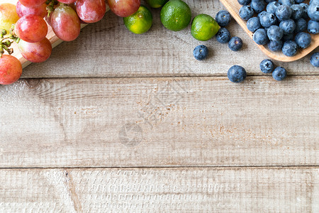 果葡萄浆蓝莓提子金桔水果组合背景