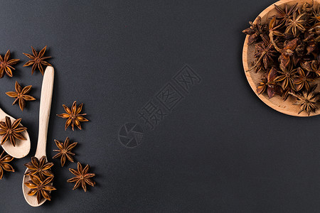 黑底星型素材木勺八角香料组合背景