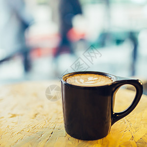 咖啡杯背景虚化拍摄背景图片