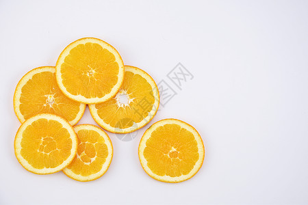 橘黄色橙子背景水果切片摆拍背景
