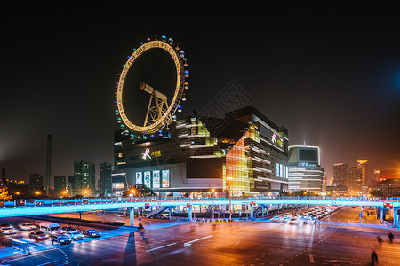 彩色摩天轮城市车流夜景慢门拍摄背景