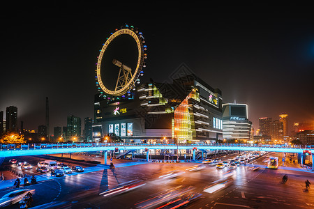 彩色摩天轮城市车流夜景慢门拍摄背景