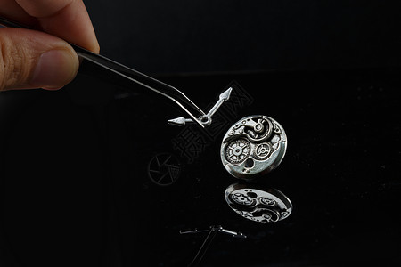 金属表盘镊子指针和金属质感的表盘背景
