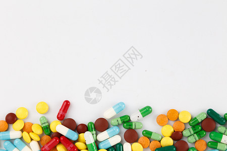 医疗物品各种颜色彩色的药片和胶囊背景