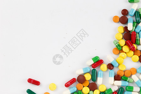 常用物品素材各种颜色彩色的药片和胶囊背景