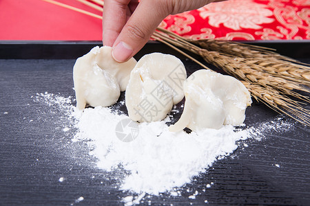 糖饺子冬至过年正在制作手工饺子背景