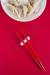 中国冬至简洁红色喜庆背景的热饺子背景