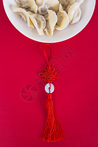 过年合家中国冬至简洁红色喜庆背景的热饺子背景