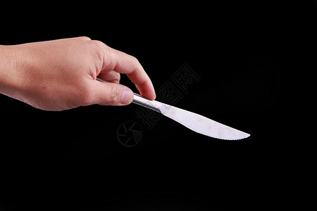 手拿餐刀背景图片