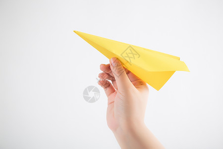 个性纸飞机单手手势棚拍背景