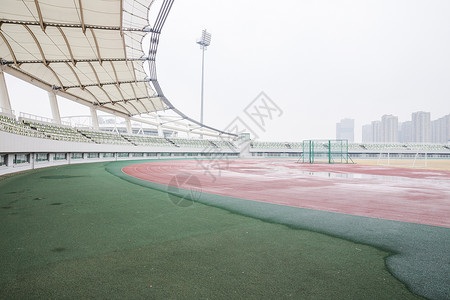 室外雨天城市建筑阴雨天体育场背景