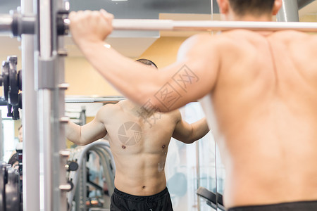 健身房健身运动肌肉动作示范背景