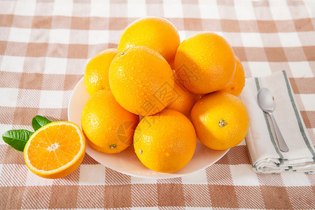 黄橙相交遮阳伞色彩斑斓的水果背景