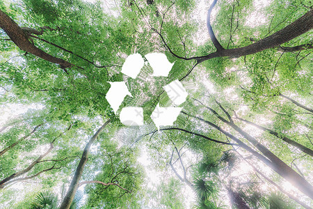 手工镂空素材森林顶部的循环标志设计图片