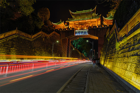 凤凰古城城门车轨夜景背景图片