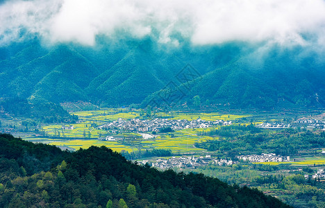 远眺村庄田野油菜花高清图片