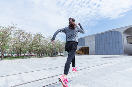 粉色运动服大气户外运动女孩跑步背景