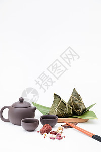 端午粽子茶壶静物白色桌面摄影图片