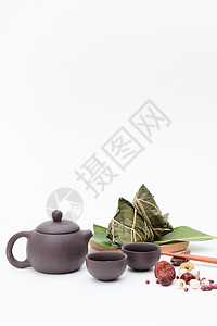 端午粽子茶壶静物白色桌面摄影高清图片