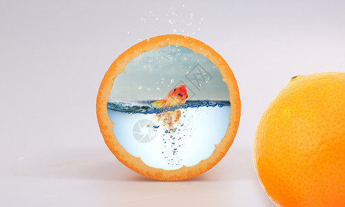 切开水果橙子里的金鱼设计图片