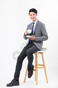 穿西装坐着喝咖啡放松男性高清图片