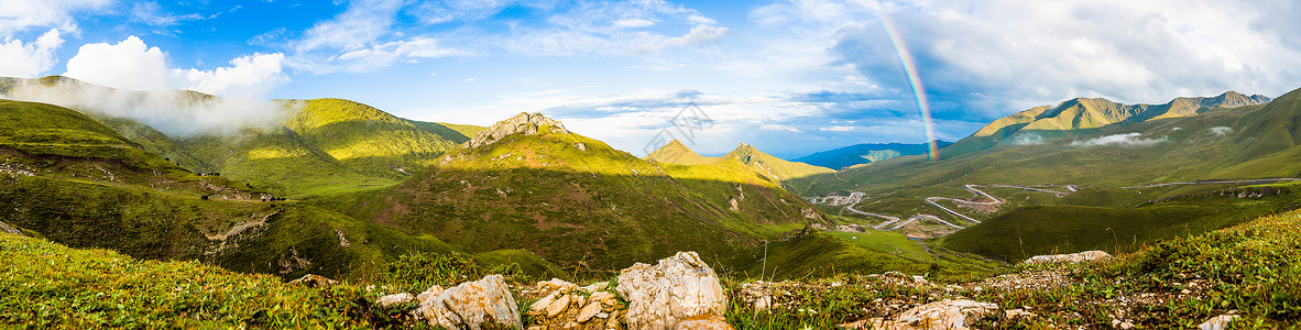 彩虹草地山间的彩虹背景