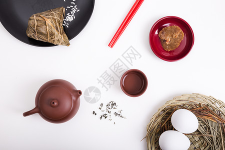 端午节食用粽子喝茶背景图片