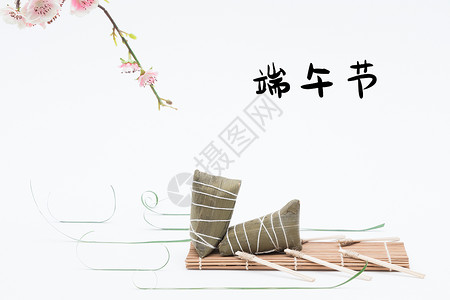 包粽子的绿叶端午节设计图片