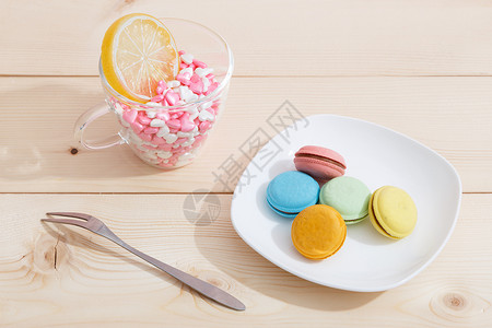 5月春茶节艺术字设计创意甜品组合背景