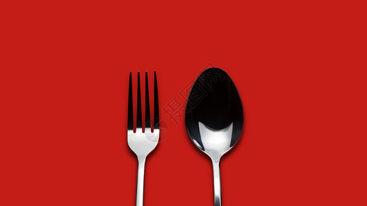 红色背景的叉与勺高清图片