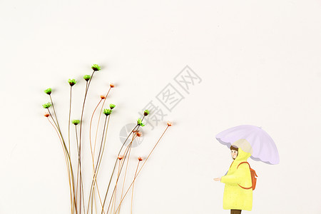 雨伞雨衣打伞的石头少年设计图片