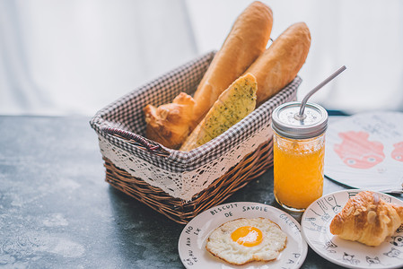 橙子面包西餐早餐面包橙汁水果背景