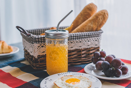 舒适的杯子西餐早餐面包橙汁水果背景