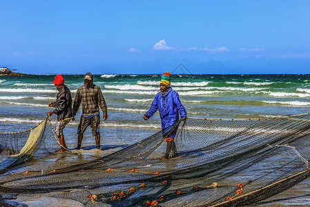 捕鱼人海滩上的渔民背景
